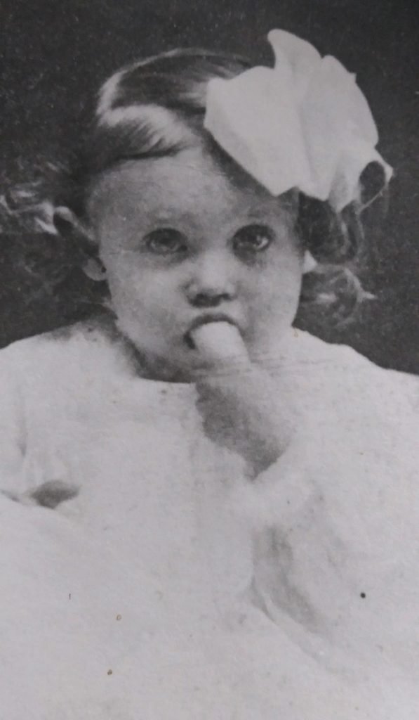 Mary Kathleen as a little girl eating a banana